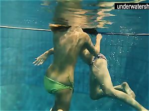 two sexy amateurs showcasing their bods off under water